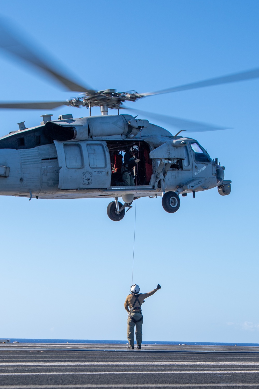 Sailors from HSC-12 conduct a hoisting exercise aboard USS Ronald Reagan (CVN 76)