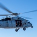 Sailors from HSC-12 conduct a hoisting exercise aboard USS Ronald Reagan (CVN 76)