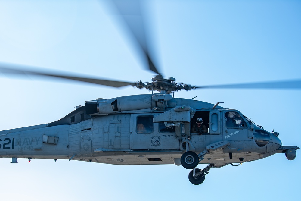 Sailors from HSC-12 conduct a hoisting exercise aboard USS Ronald Reagan (CVN 76)