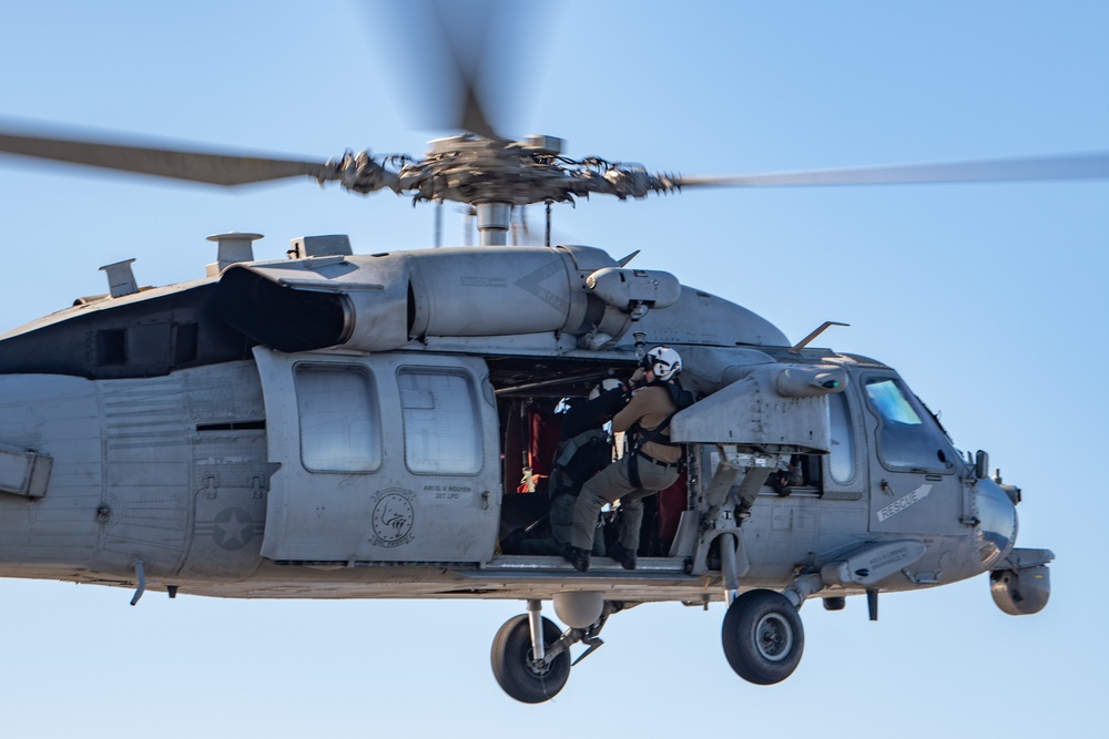 Sailors from HSC-12 conduct a hoisting exercise aboard USS Ronald Reagan (CVN 76)