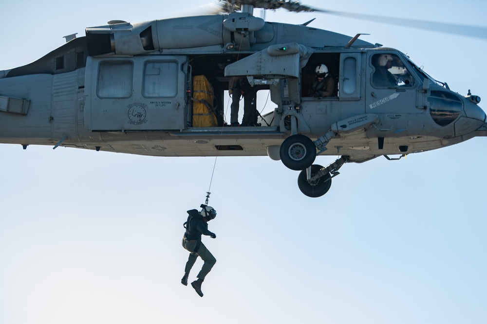 Sailors from HSC-12 conduct a hoisting exercise aboard USS Ronald Reagan (CVN 76)