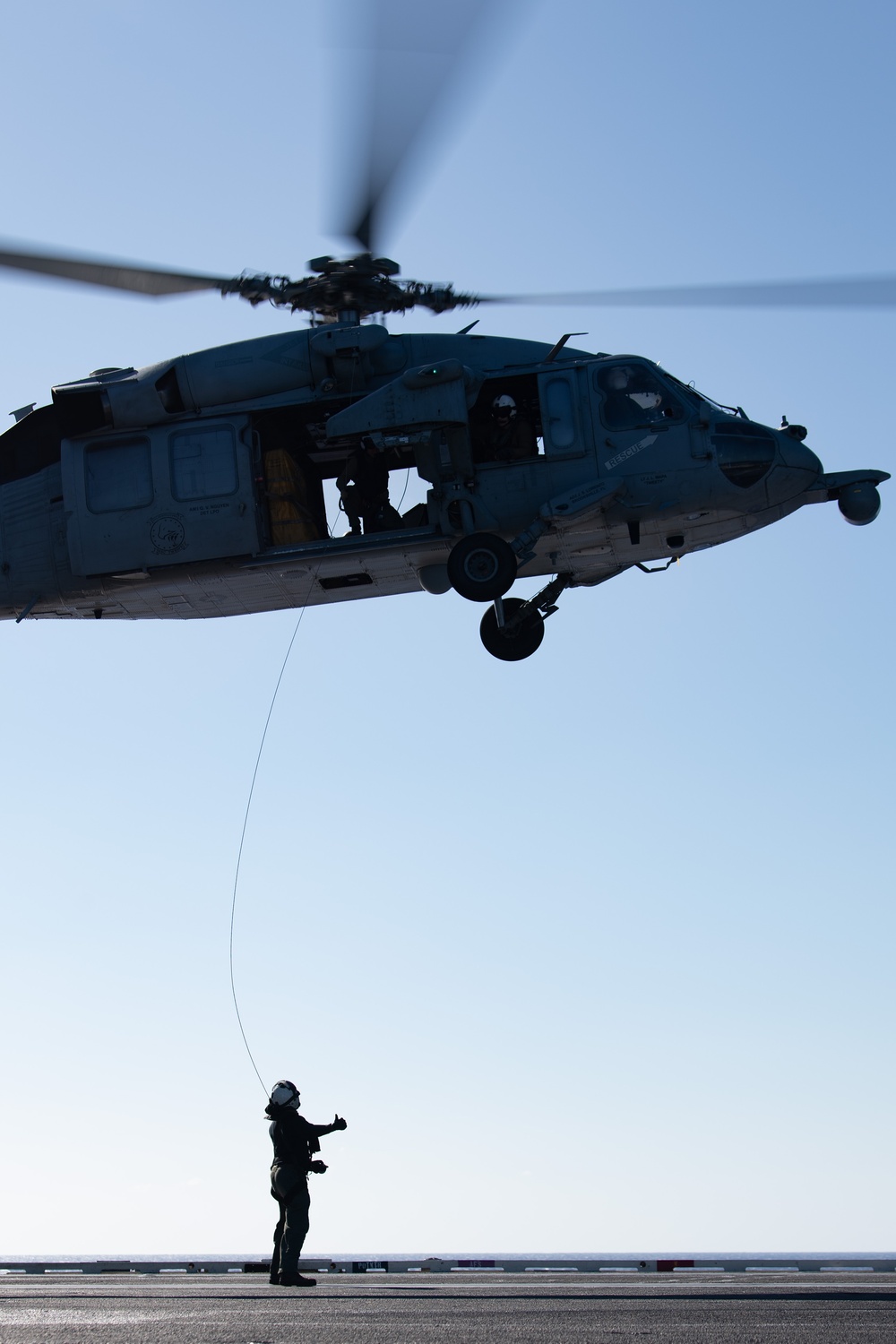 Sailors from HSC-12 conduct a hoisting exercise aboard USS Ronald Reagan (CVN 76)