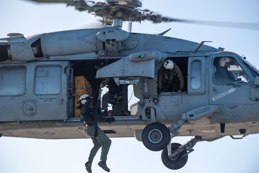 Sailors from HSC-12 conduct a hoisting exercise aboard USS Ronald Reagan (CVN 76)