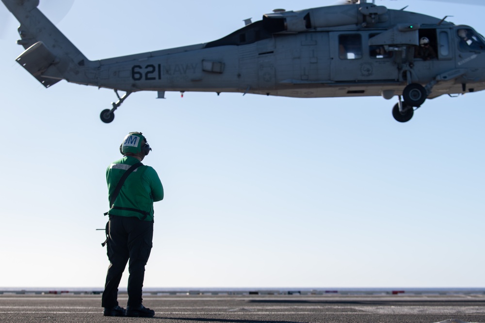 Sailors from HSC-12 conduct a hoisting exercise aboard USS Ronald Reagan (CVN 76)