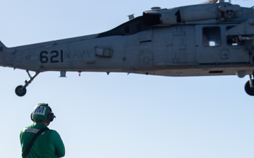 Sailors from HSC-12 conduct a hoisting exercise aboard USS Ronald Reagan (CVN 76)