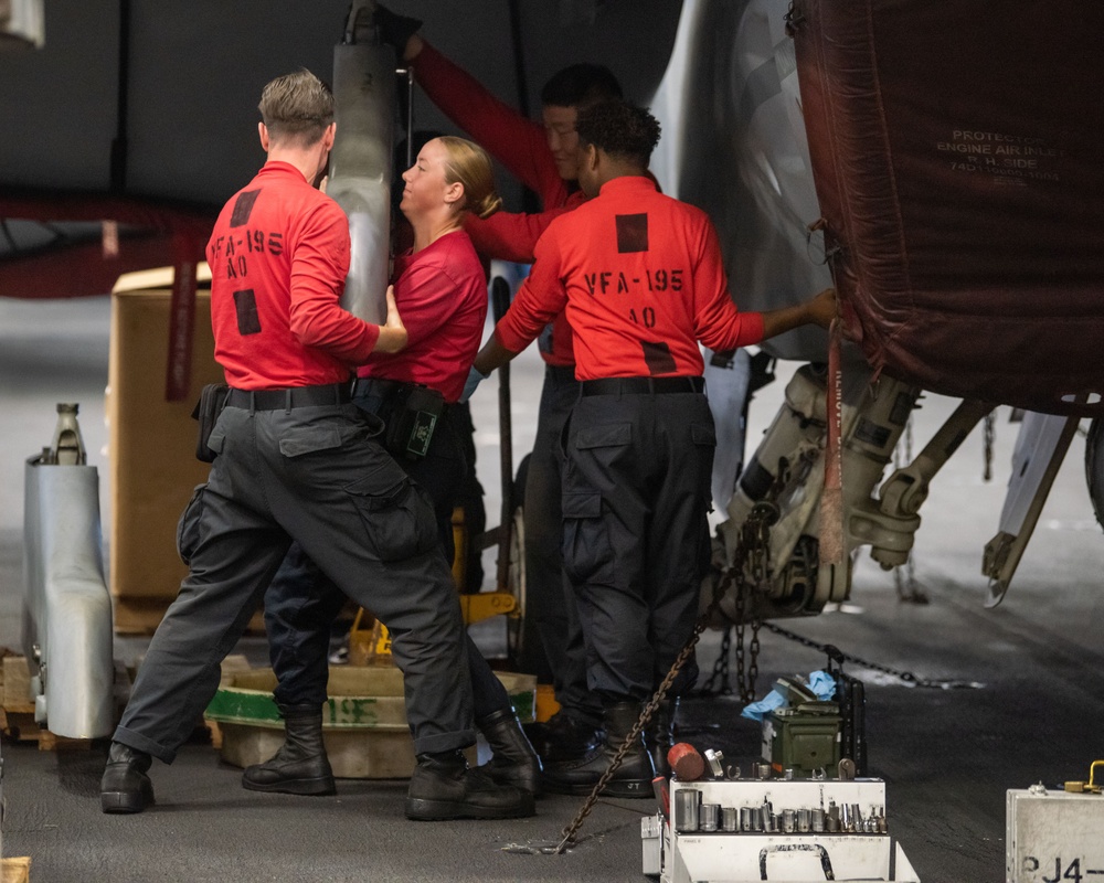 USS Ronald Reagan (CVN 76) Sailors perform maintenance on aircraft while underway