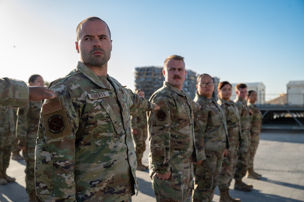 332d Expeditionary Logistics Readiness Squadron conduct an open ranks inspection while deployed