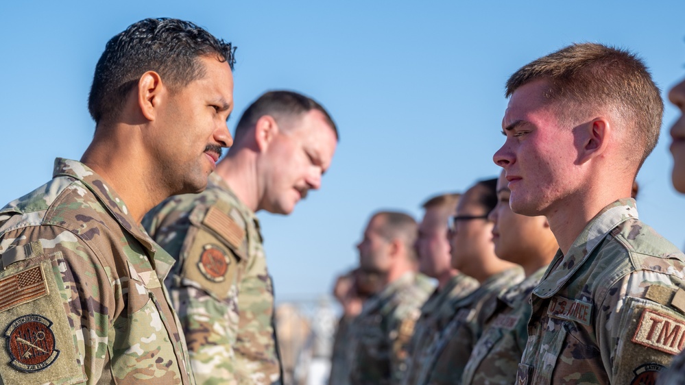 332d Expeditionary Logistics Readiness Squadron conduct an open ranks inspection while deployed