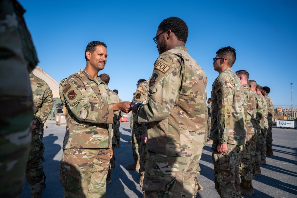 332d Expeditionary Logistics Readiness Squadron conduct an open ranks inspection while deployed