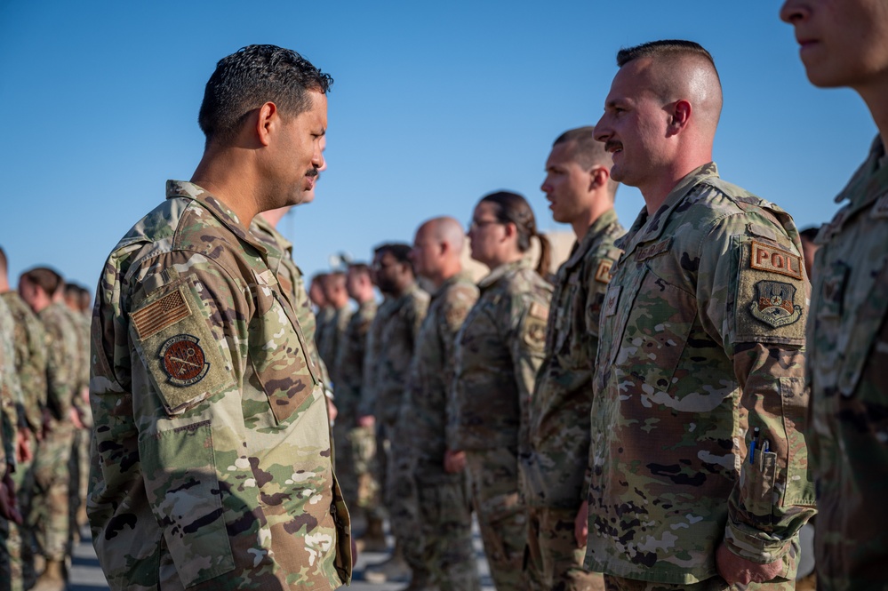 332d Expeditionary Logistics Readiness Squadron conduct an open ranks inspection while deployed