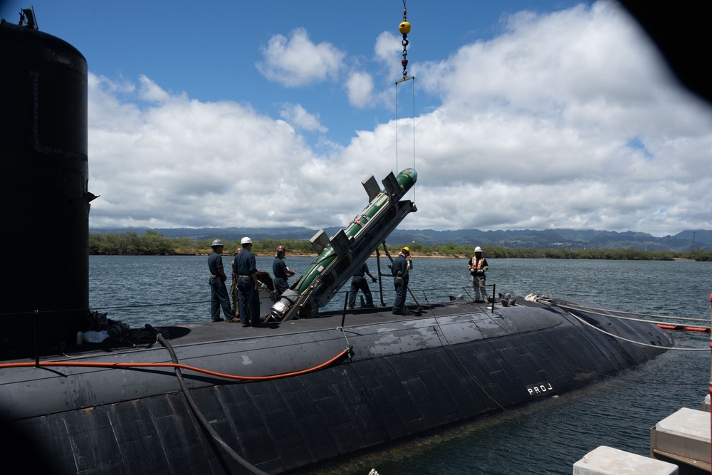 Sailors load torpedoes onto submarine USS Topeka for RIMPAC 2024