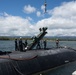 Sailors load torpedoes onto submarine USS Topeka for RIMPAC 2024