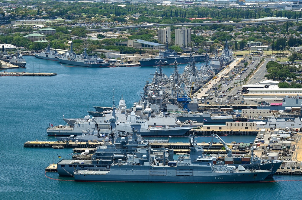 Aerial view of ships moored at Pearl Harbor and Ford Island during RIMPAC 2024