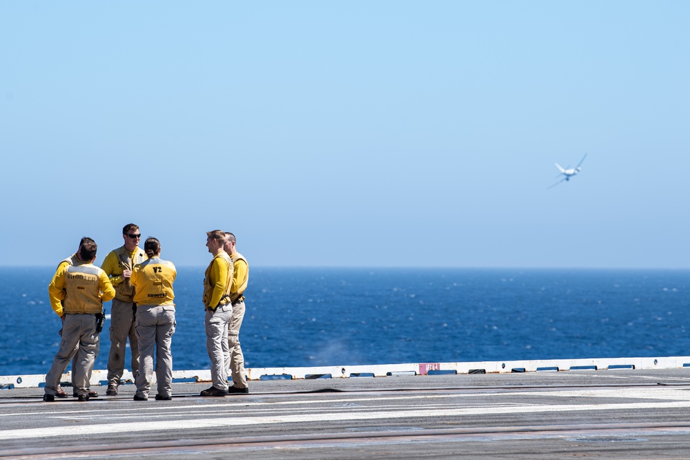 Sailors Observe A P-8A Poseidon Flyby