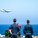 Sailors Observe A P-8A Poseidon Flyby