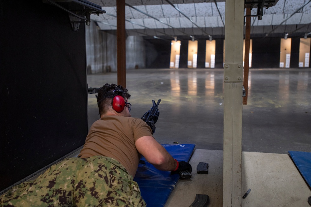 Sailor Fires An M4 Rifle
