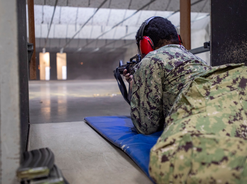Sailor Fires An M4 Rifle