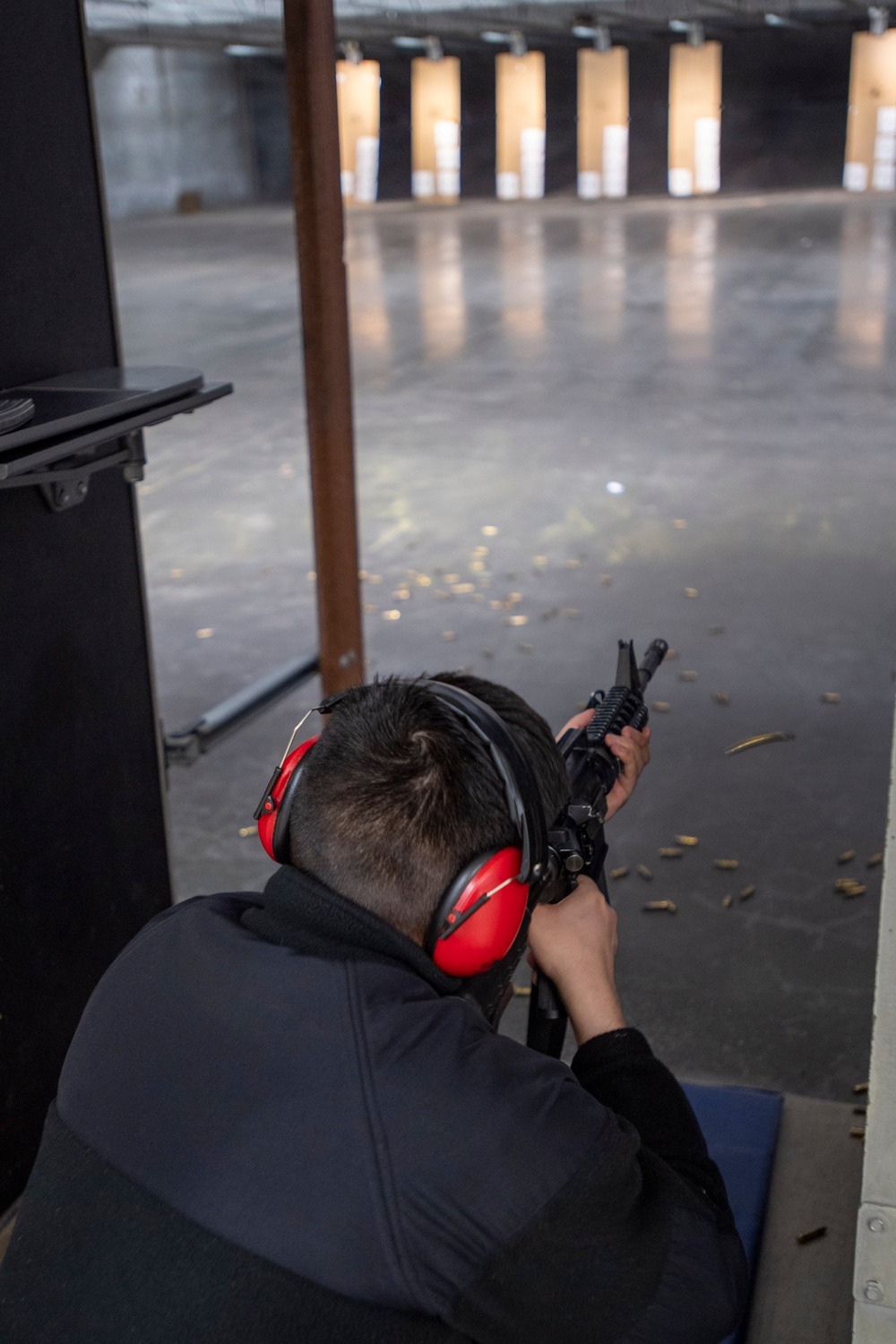 Sailor Fires An M4 Rifle