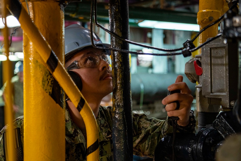 Engineman Conducts Gauge Check On Diesel Generator