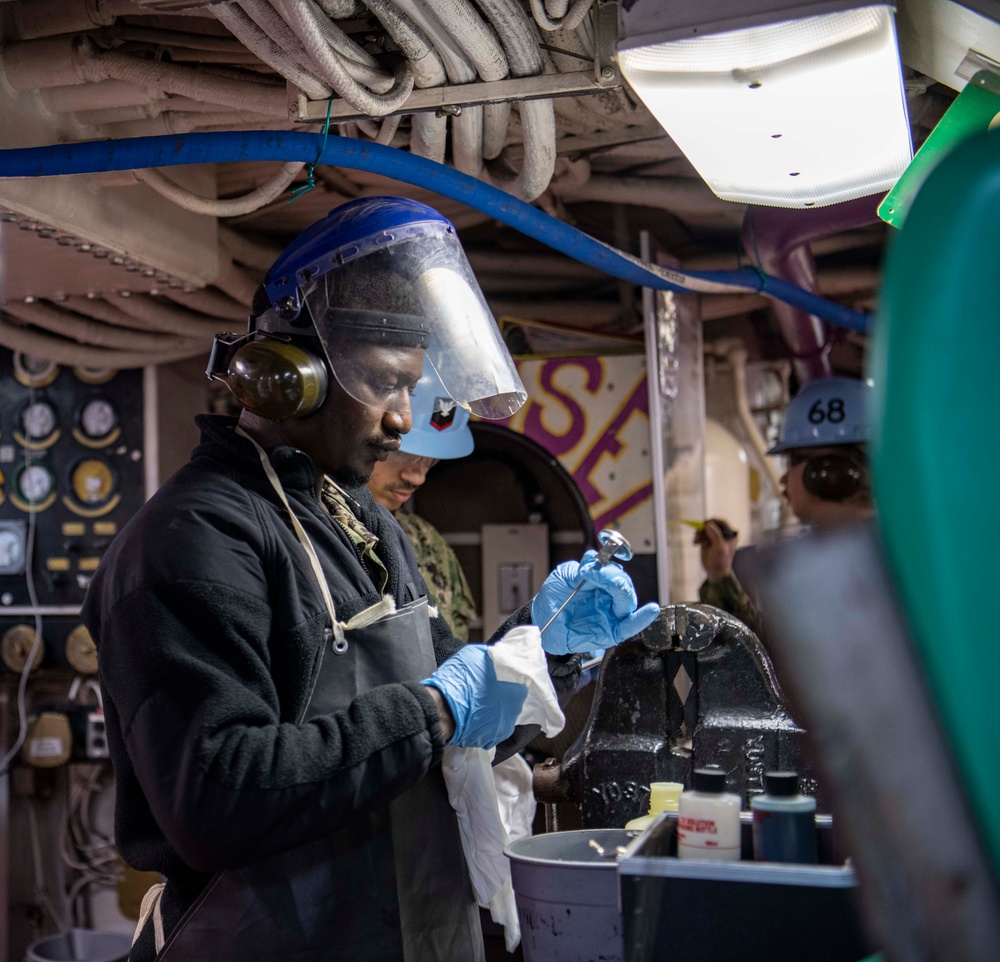 Sailor Cleans Instruments For Fuel Sample Test