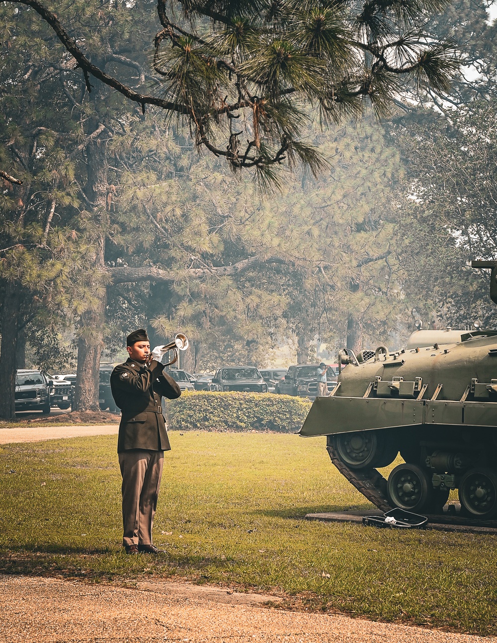 Soldier playing bugle during memorial day ceremony 2024