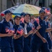 Coast Guard members participate in Fourth of July parade