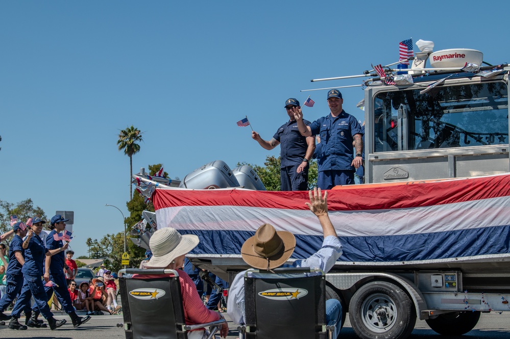 Coast Guard members participate in Fourth of July parade