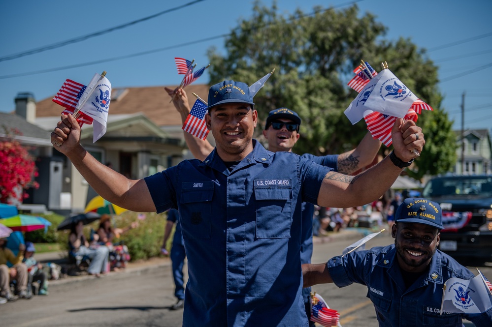 Coast Guard members participate in Fourth of July parade