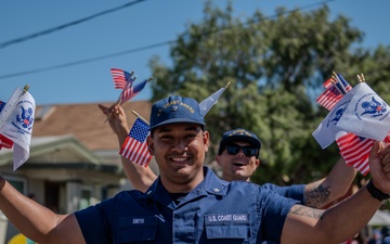 Coast Guard members participate in Fourth of July parade