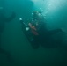 U.S. and Canadian divers scan the USS Utah Memorial during RIMPAC 2024