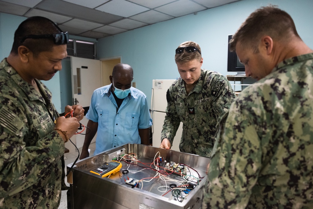 Sailors assess repair at the Kingston Public Hospital