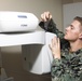 Sailors assess repair at the Kingston Public Hospital