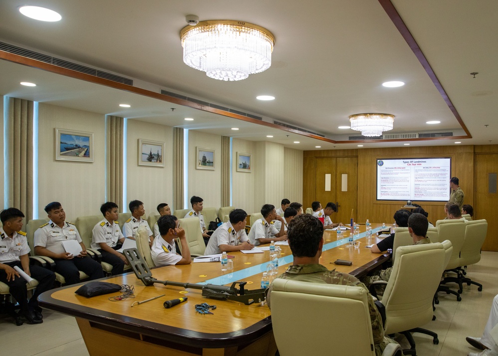 Members of the U.S. Navy, U.S. Coast Guard, U.S. 7th Fleet, and Vietnamese Navy and Coast Guard participate in a joint U.S. – Vietnam subject matter expert exchange