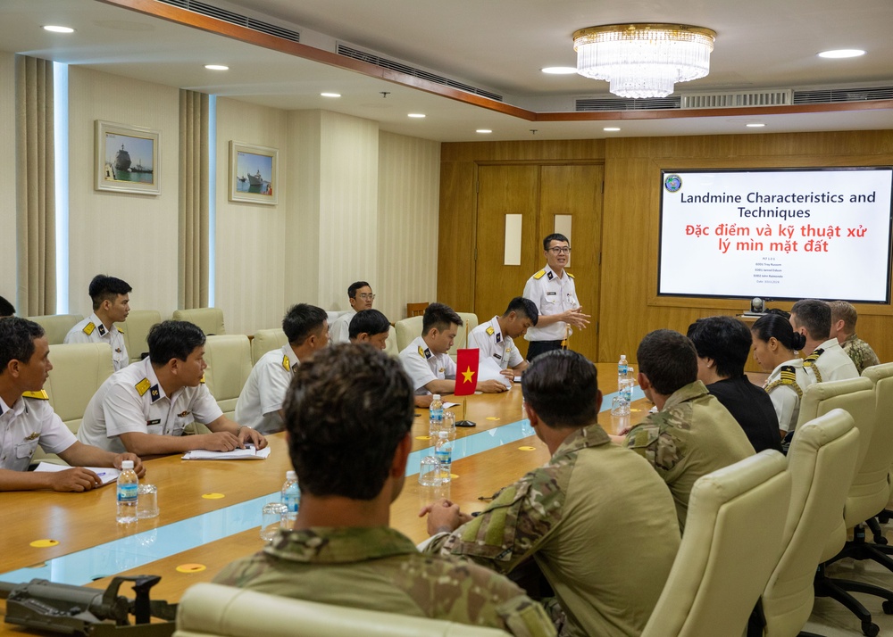 Members of the U.S. Navy, U.S. Coast Guard, U.S. 7th Fleet, and Vietnamese Navy and Coast Guard participate in a joint U.S. – Vietnam subject matter expert exchange