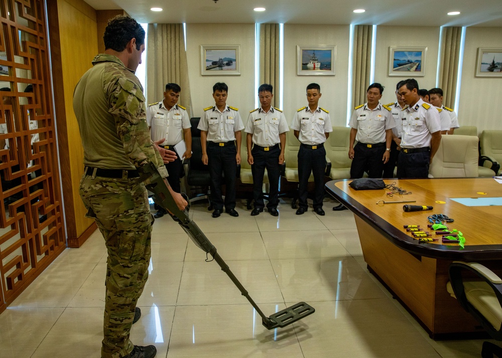 Members of the U.S. Navy, U.S. Coast Guard, U.S. 7th Fleet, and Vietnamese Navy and Coast Guard participate in a joint U.S. – Vietnam subject matter expert exchange