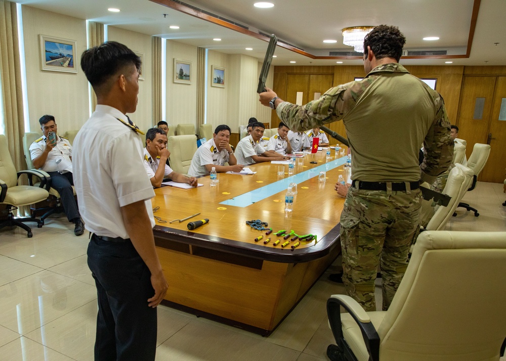 Members of the U.S. Navy, U.S. Coast Guard, U.S. 7th Fleet, and Vietnamese Navy and Coast Guard participate in a joint U.S. – Vietnam subject matter expert exchange