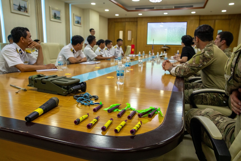 Members of the U.S. Navy, U.S. Coast Guard, U.S. 7th Fleet, and Vietnamese Navy and Coast Guard participate in a joint U.S. – Vietnam subject matter expert exchange