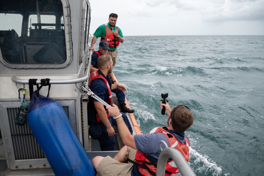 Coast Guard rescue crew conducts interview with local media