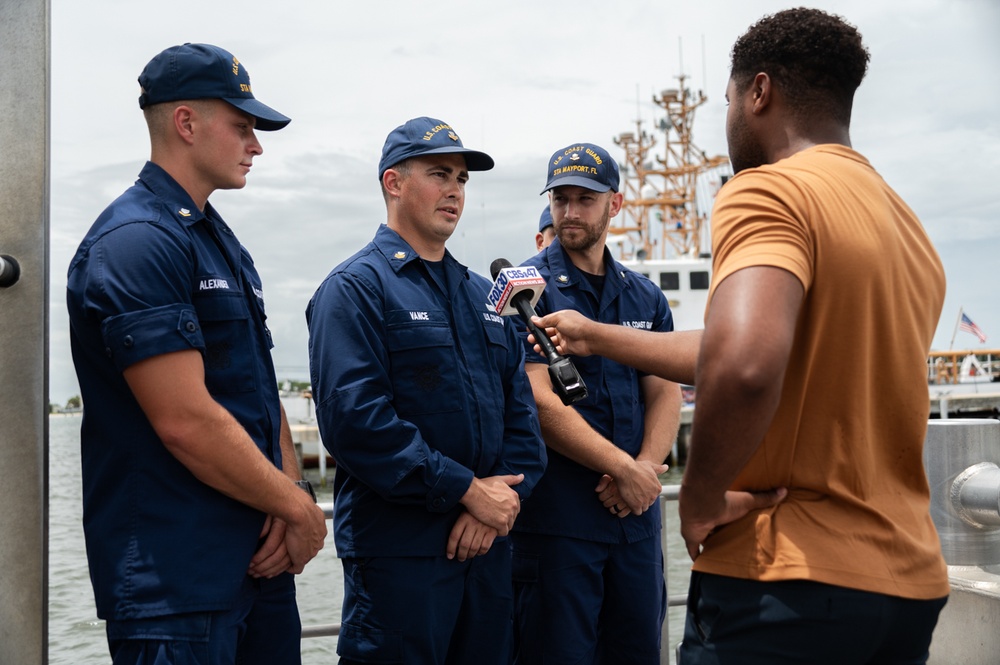 Coast Guard rescue crew conducts interview with local media