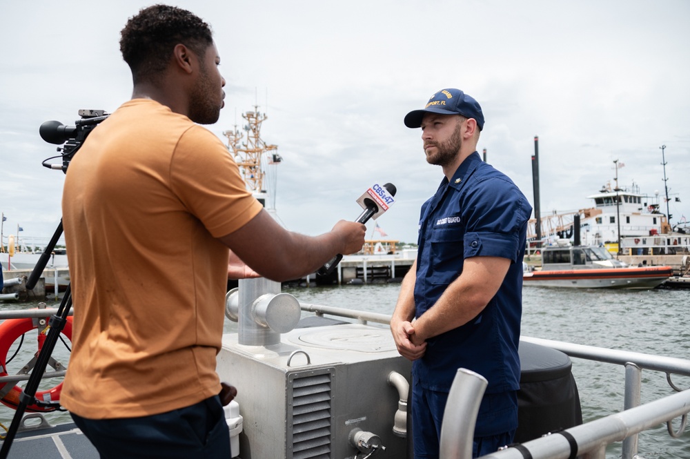 Coast Guard rescue crew conducts interview with local media