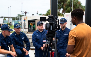 Coast Guard rescue crew conducts interview with local media