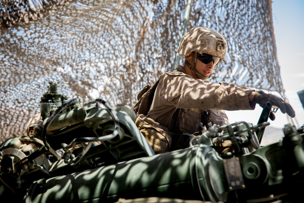 Marines fire artillery during Integrated Training Exercise 4-24