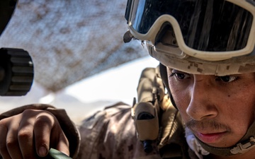 Marines fire artillery during Integrated Training Exercise 4-24
