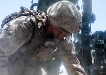 Marines fire artillery during Integrated Training Exercise 4-24