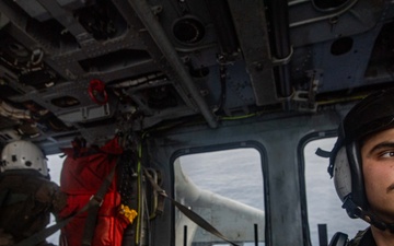 Naval Air Crewman Conducts Operations