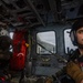 Naval Air Crewman Conducts Operations