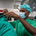 US and Angolan military healthcare teams work together in the OR