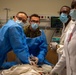 US and Angolan military healthcare teams work together in the ER