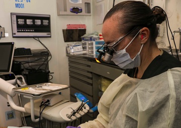 Wasp Dental Officer Conducts Filling Underway