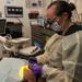Wasp Dental Officer Conducts Filling Underway